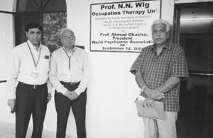Dr Ajit Avasthi and Dr P N. Kulhara of the PGIMER, Chandigarh and Dr Afzal Javed of Pakistan pose by the side of the inauguration plaque of "Prof N.N. Wig Occupation Therapy Unit" at the Fountain House Psychiatric Centre, Lahore.