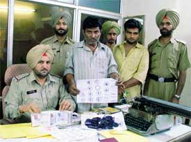 Kasturi Lal and his accomplice Baljinder Singh at Division No 6 police station in Ludhiana