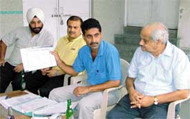 From right Mr Kedar Nath Malhotra, Mr Anupam Kumaria and Mr Arun Dhand at a press conference of the Ludhiana District Badminton Association 