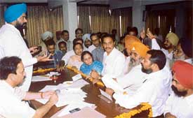 Mr Praveen Bansal, leader of the BJP in the Ludhiana Municipal Corporation, objects to the presence of outsiders during the MC general house meeting in Ludhiana