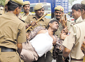 A man protesting against the proposed construction of a slaughterhouse in Ghazipur, being arrested by the police in the Capital on Saturday.