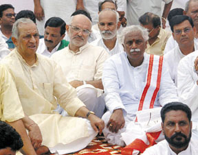 Annasahib M.K. Patil, president, BJP Kissan Morcha, along with Sahib Singh Verma and Bandaru Dattareya sitting on a dharna against the anti-farmer policies of Dr Manmohan Singh's government, at Rajghat in the Capital on Saturday.