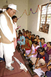 Union Sports and Youth Affairs Minister Sunil Dutt interacts with young girls after inaugurating a vocational training centre on the occasion of Mahatma Gandhi's 135th birth anniversary