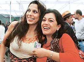 Actress Pooja Bedi hugs a batchmate at the 157th founders day celebrations