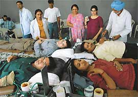 Volunteers donate blood at a blood donation camp organised by the NIFT, Mohali, on Monday. 