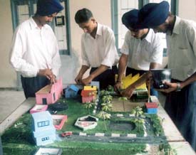 Students demonstrate a science model at Baba Isher Singh School in Ludhiana