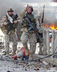 US army troops guard the site of a bombing attack in central Baghdad 