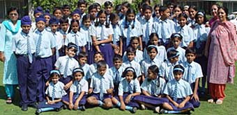 Students of Air Force School, 12 Wing, Chandigarh, pose for a photograph outside The Tribune office on their visit on Tuesday.