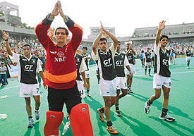 Pakistani players acknowledge cheers from the crowd after the match in Chandigarh on Wednesday.