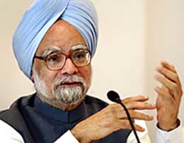 Prime Minister Manmohan Singh gestures during a news conference in Mumbai on Wednesday.