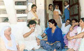 Leaving behind loved ones: Relatives of Rakesh Kumar wail after hearing the news of his suicide at Hailbowal in Ludhaian on Wednesday.