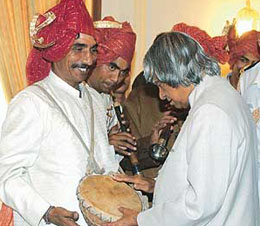 President A.P.J. Abdul Kalam interacts with shehnai artistes after receiving a pankha of flowers from members of the Anjuman Sair-e-Gul Faroshan on the occasion of "Phool Walon Ki-Sair" at Rashtrapati Bhavan in New Delhi on Wednesday.