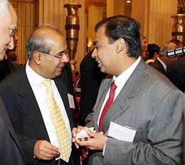 Chairman and Managing Director, Reliance Industries, Mukesh Ambani has a word with P. Hinduja at the India investment forum in New York on Wednesday.