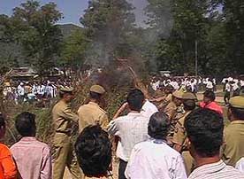 Policemen destroy charas seized in several raids in Mandi on Monday.