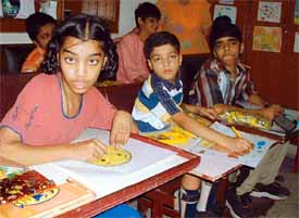 Mentally challenged children take part in a painting competition organised at Aashirwad Ashram in Ludhiana