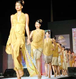 Models display designer wear at a fashion show held in Ludhiana