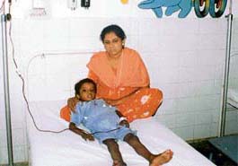 Seven-year-old Alisha with his mother