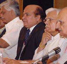 Dr Sanjay Baru, Media Adviser to the Prime Minister, Mr Imtiaz Alam, Secretary-General, SAFMA, Mr K. Natwar Singh, Minister for External Affairs, and Mr K.K. Katyal, President, SAFMA, at a conference in New Delhi on Saturday.