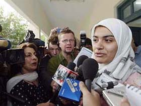 Moqadasa Sidiqi, 19- year-old Afghan refugee in Pakistan, speaks to the media