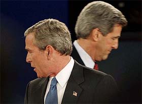 US President George W. Bush and Democratic presidential nominee John Kerry turn away from each other