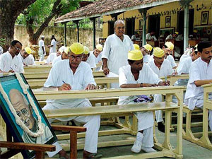 Prisoners at Ahmedabad's Sabarmati Central Jail appear for a test on Mahatma Gandhi's Ideals