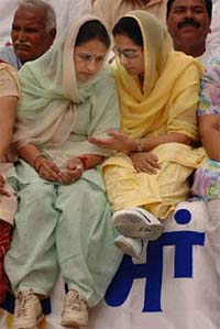 Ms Preneet Kaur, MP, interacts with Congress candidate Sukhjinder Kaur Rana on the stage at an election rally in Kapurthala