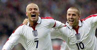 David Beckham celebrates with Michael Owen after scoring against Wales