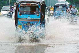 Caught in a downpour, Chandigarhians slow down their vehicles on inundated roundabouts and roads