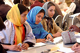 Afghan election staff count ballots at a UN office at Herat airport on Monday