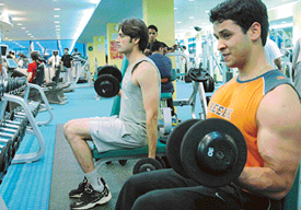 Youngsters work out at a gym in Chandigarh.