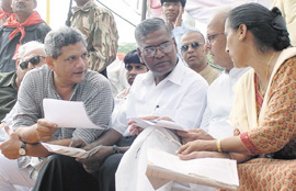 Former Prime Minister V. P. Singh along with Sitaram Yechuri and D. Raja at a rally protesting against the closure of industries in non-conforming areas in the Capital on Tuesday. 