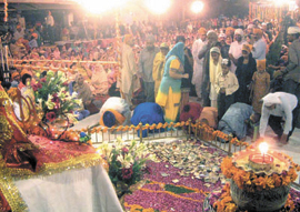 On the completion of 400 years of Sikh religion, the devotees organise a Kirtan Darbar at Ashok Vihar Central Market in the Capital on Monday. 