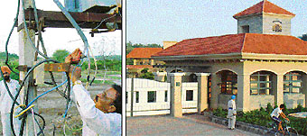 A technician from the Punjab State Electricity Board disconnects power supply to the Forest Country Club and Resort, which has been closed down following court orders, at Karoran village on Wednesday and a view of the club. 