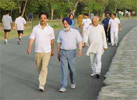 City residents enjoy their morning walk at the Sukhna Lake, Chandigarh.