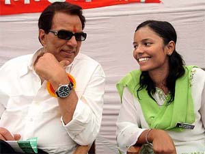Member of Parliament and Bollywood actor Dharmendra interacts with a local student leader