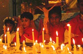 Children pray on the occasion of St Peters Mother Mary day celebrations at St Peters Academy in Patiala on Wednesday.