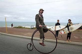 Lloyd Scott of Britain practices aborad his Penny-Farthing on Tuesday outside Perth in Australia for cycling 2,700 miles across Australia on the cycle.