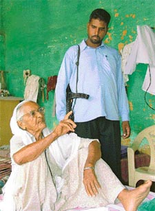 Ms Jaswant Kaur narrates her tale of woes as her bodyguard looks on at Amargarh Kaleran village
