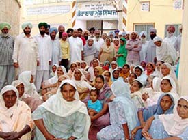 Devotees outside Baba Mal Singh Gurdwara to prevent its occupation by followers of Baba Hamir Singh Dera in Moga on Thursday.