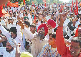 CITU members hold a rally in support of their demands at Matka Chowk in Chandigarh on Thursday.