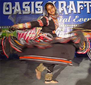 An artist from Rajasthan perform during the Oasis Krafts Mela