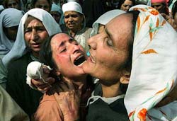 Relatives wail during the funeral of Abdul Rahim Sofi and his son Gowhar Ahmad