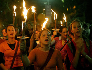 Israeli girls hold candles during a demonstration