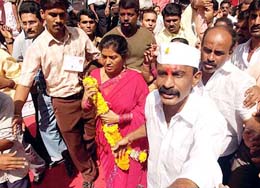 Former underworld don Arun Gawli accompanied by wife Asha Gawli and supporters celebrates his victory from the Chinchpokli assembly constituency in Mumbai on Saturday. 