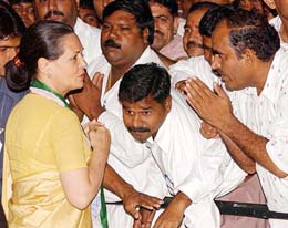 Congress President Sonia Gandhi being congratulated by party workers at her residence in New Delhi on Saturday after the Congress-NCP alliance won the Maharashtra Assembly elections on Saturday.