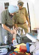 A forensic expert lifts fingerprints from the scene of crime in Sector-15, Panchkula on Sunday. 