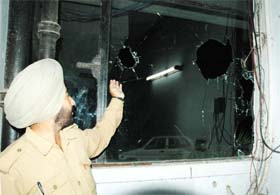 Policemen take stock of situation at the Thapar hall, PAU, Ludhiana