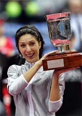 Russias Anastasia Myskina lifts the trophy after beating compatriot Elena Dementieva in the Kremlin Cup final in Moscow