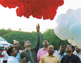 Deputy Commissioner Arun Kumar releases balloons to mark the opening of the shopping festival in Sector 17, Chandigarh