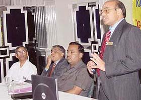 Dr R.K. Bhargava, an alumnus of Punjab Engineering College, delivers a lecture on "global energy market" at a function